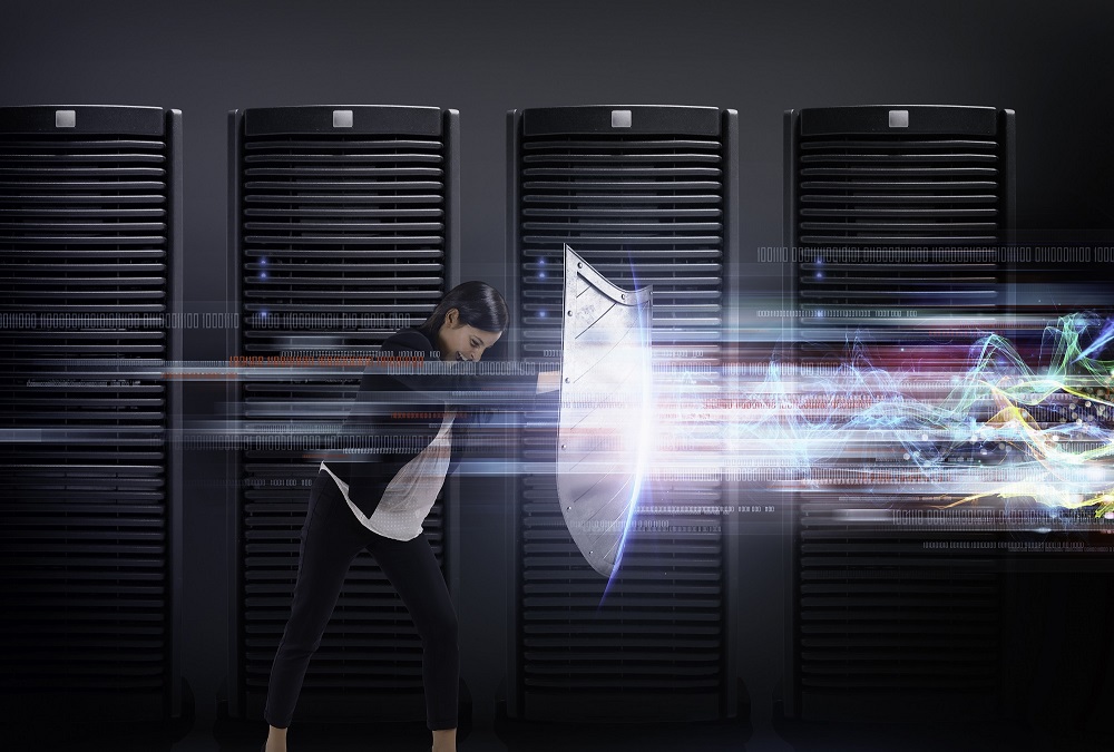 woman with shield in front of mainframe computers