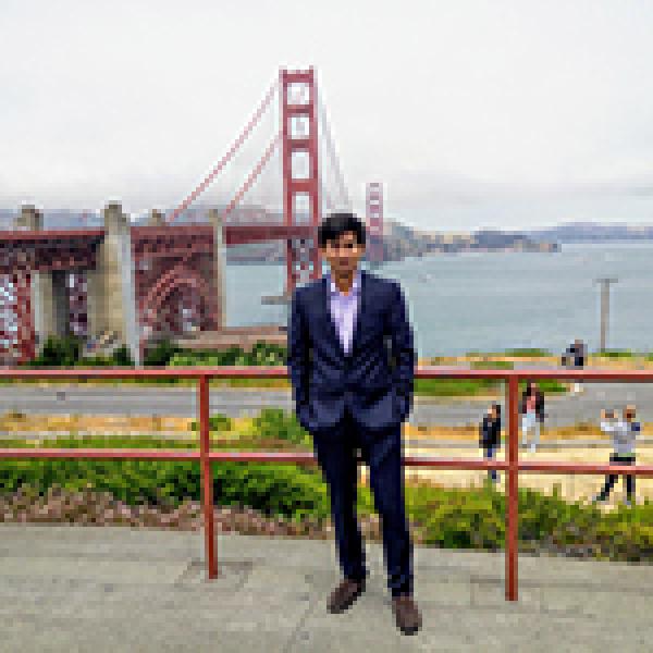 Monsur posing in front of the Golden Gate Bridge